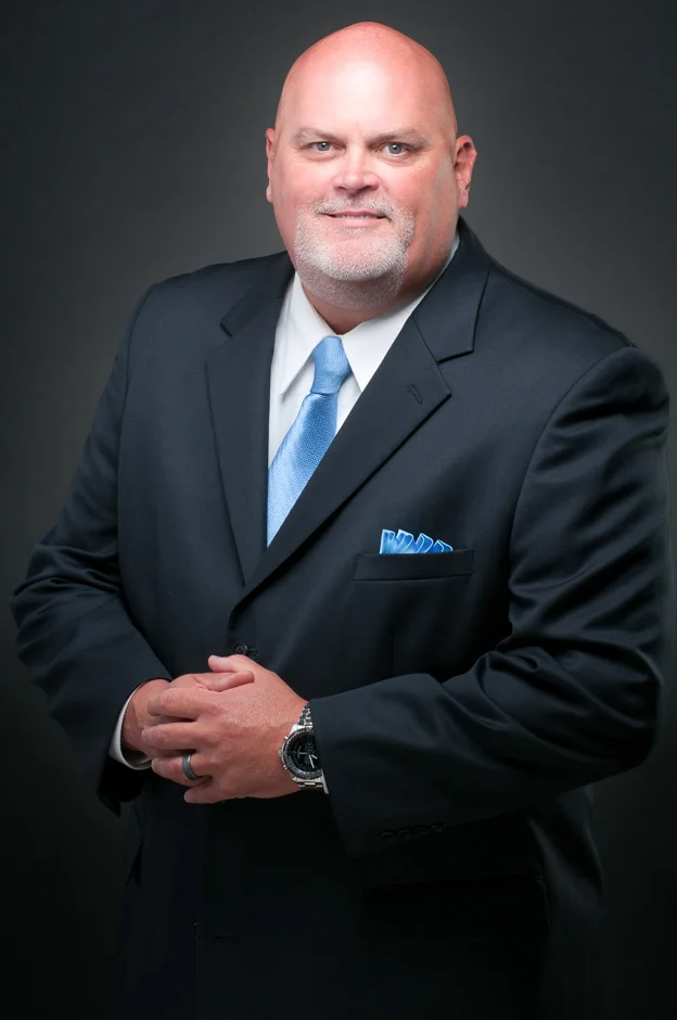 Confident and professional men's headshot by Dallas Professional Headshots, exemplifying executive presence.